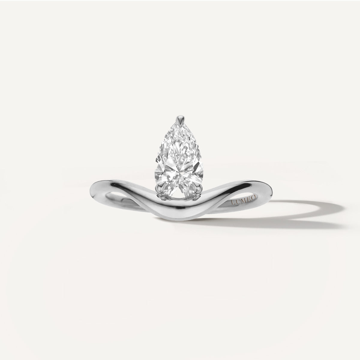 LUMEO Pear Diamond Trace Ring Front View in Platinum