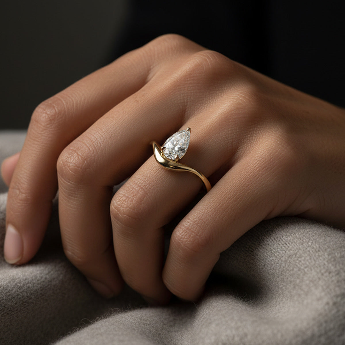 LUMEO Pear Diamond Trace Ring Front View in 18k Solid Yellow Gold on hand