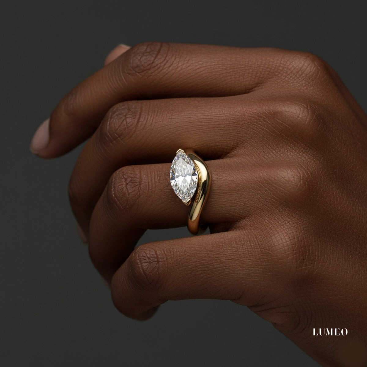 LUMEO Marquise diamond ring in 18k solid yellow gold on hand