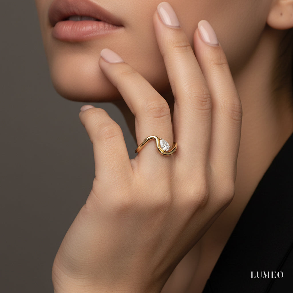 LUMEO Pear Trace Diamond Ring in 18k Solid Yellow Gold on model