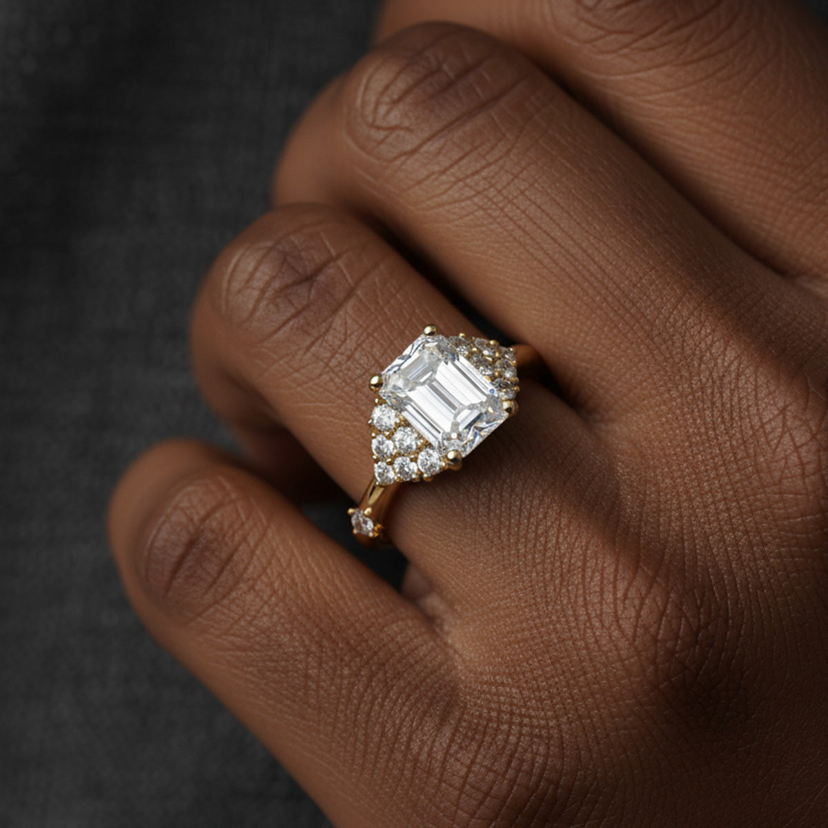 LUMEO Emerald Cluster Diamond Engagement Ring on model in 18k Solid Yellow Gold