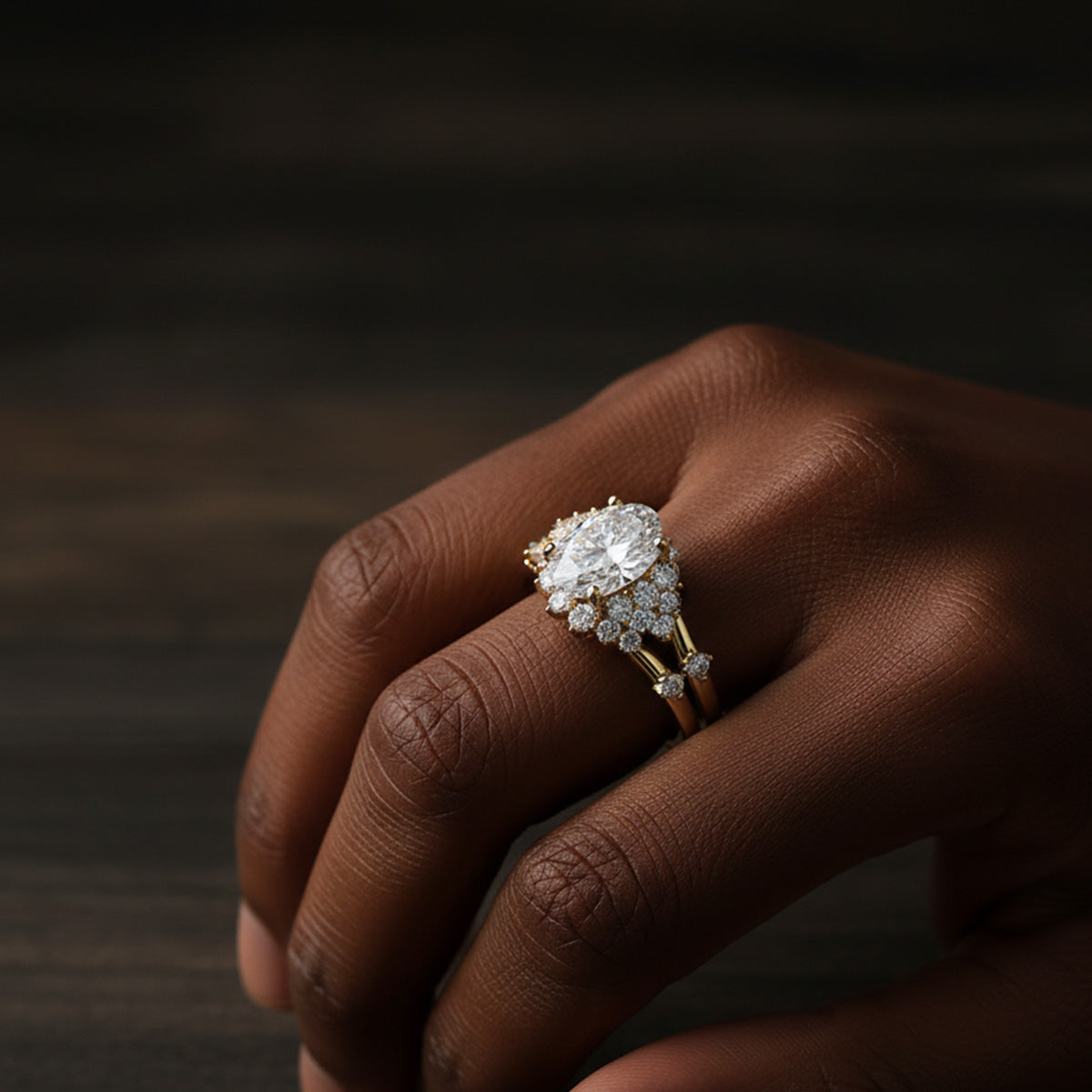 LUMEO Oval Cluster Diamond Engagement Ring with wedding band on model in 18k Solid Yellow Gold