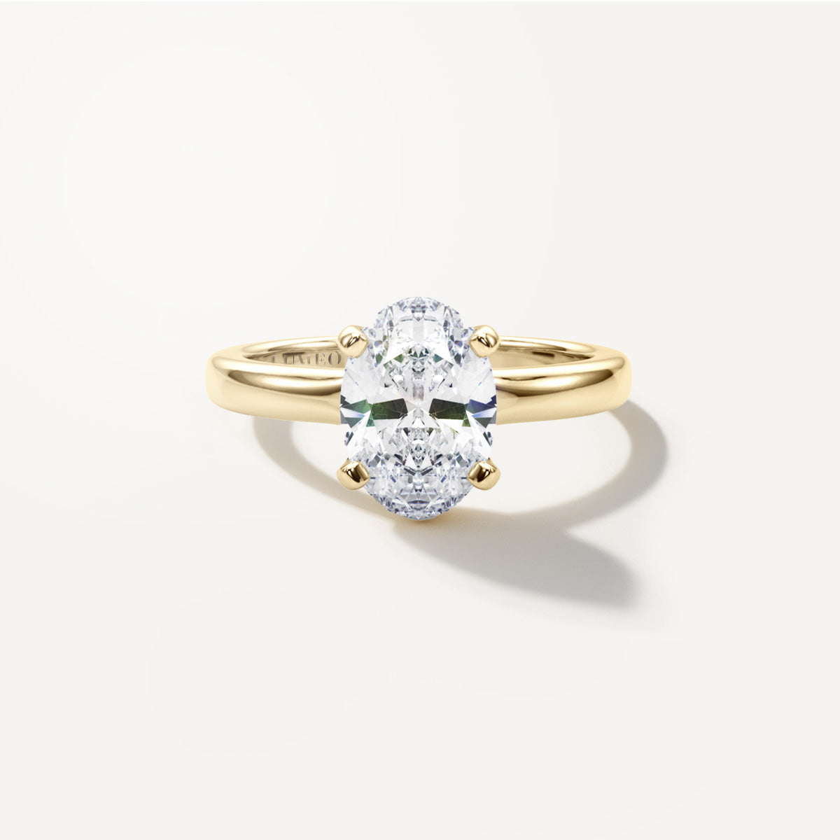 LUMEO Oval Solitaire with Contemporary Shank Diamond Engagement Ring Front View in 18k Solid Yellow Gold 