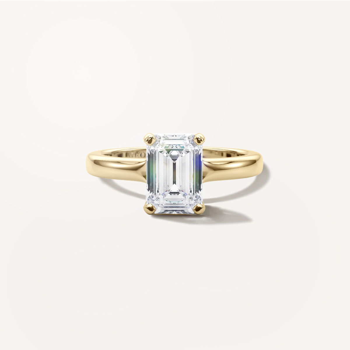 LUMEO Emerald Solitaire with Contemporary Shank Diamond Engagement Ring Front View in 18k Solid Yellow Gold 
