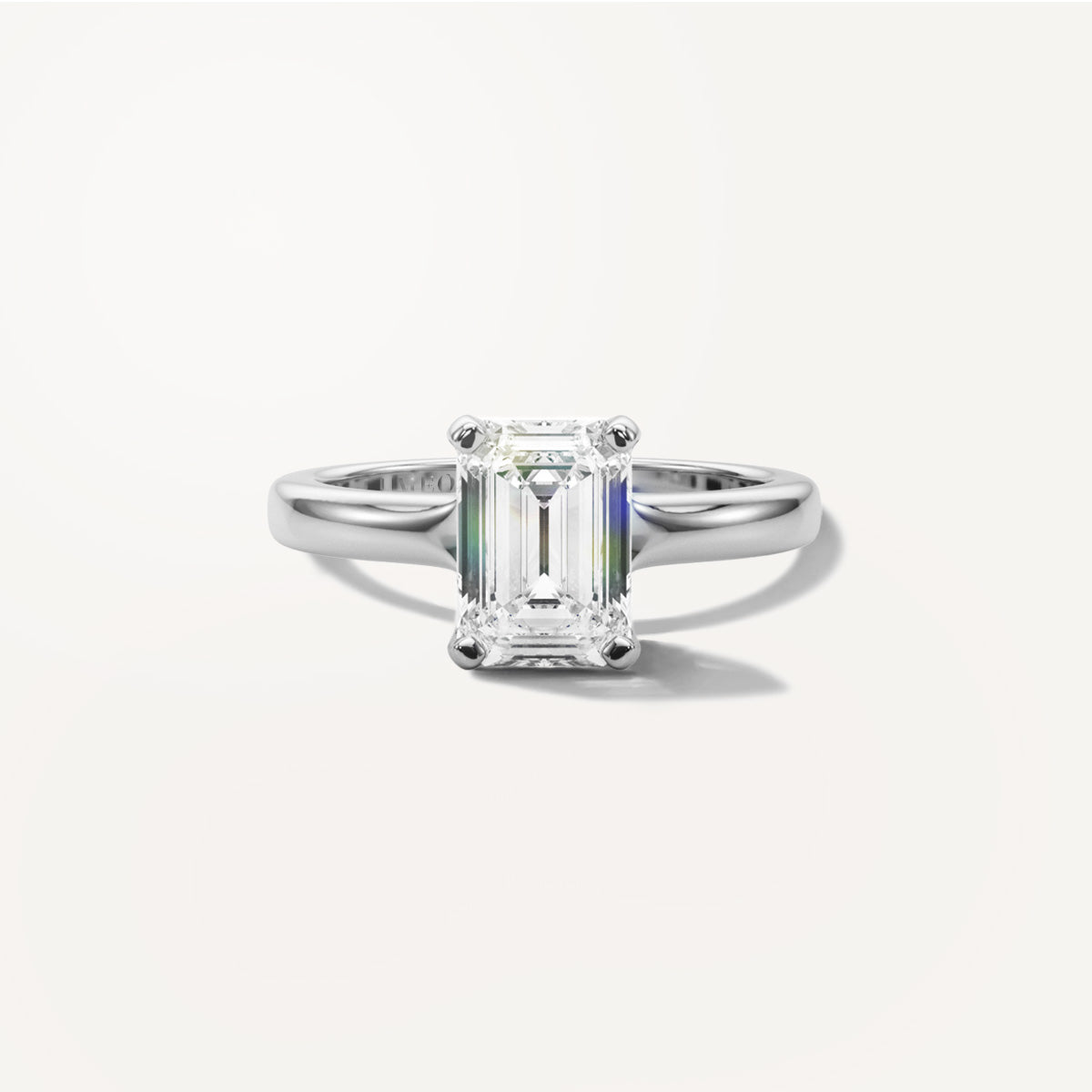LUMEO Emerald Solitaire with Contemporary Shank Diamond Engagement Ring Front View in Platinum or 18k Solid White Gold 