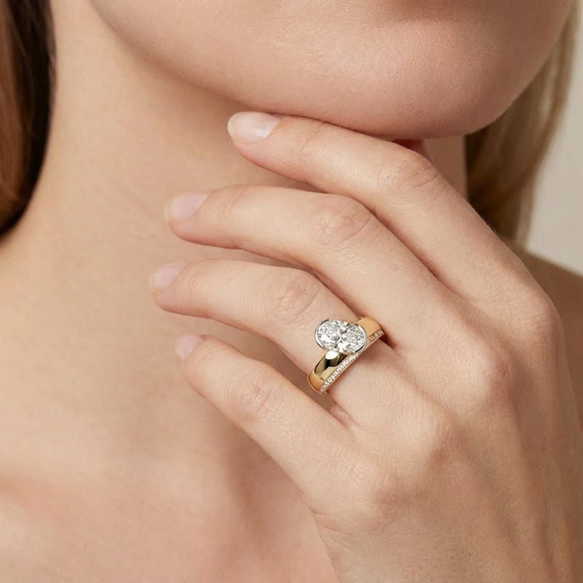 LUMEO The Sloane Oval Bezel Diamond Engagement Ring Front View in 18k Solid Yellow Gold on hand