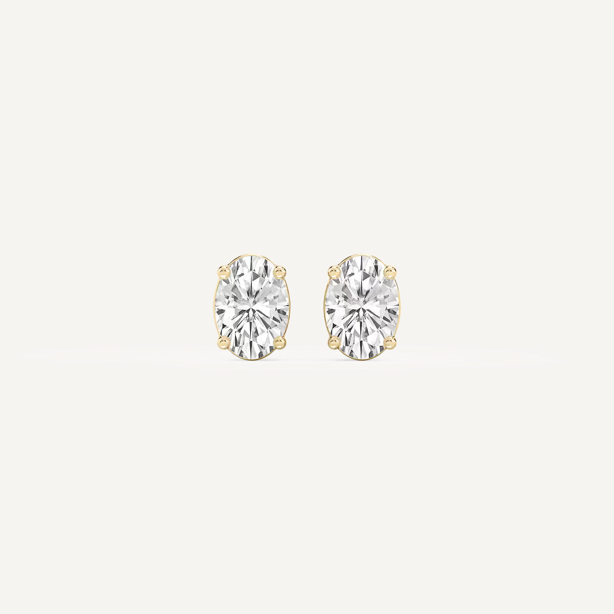 LUMEO Oval Cut Ear Studs Front View in 18k Solid Yellow Gold 