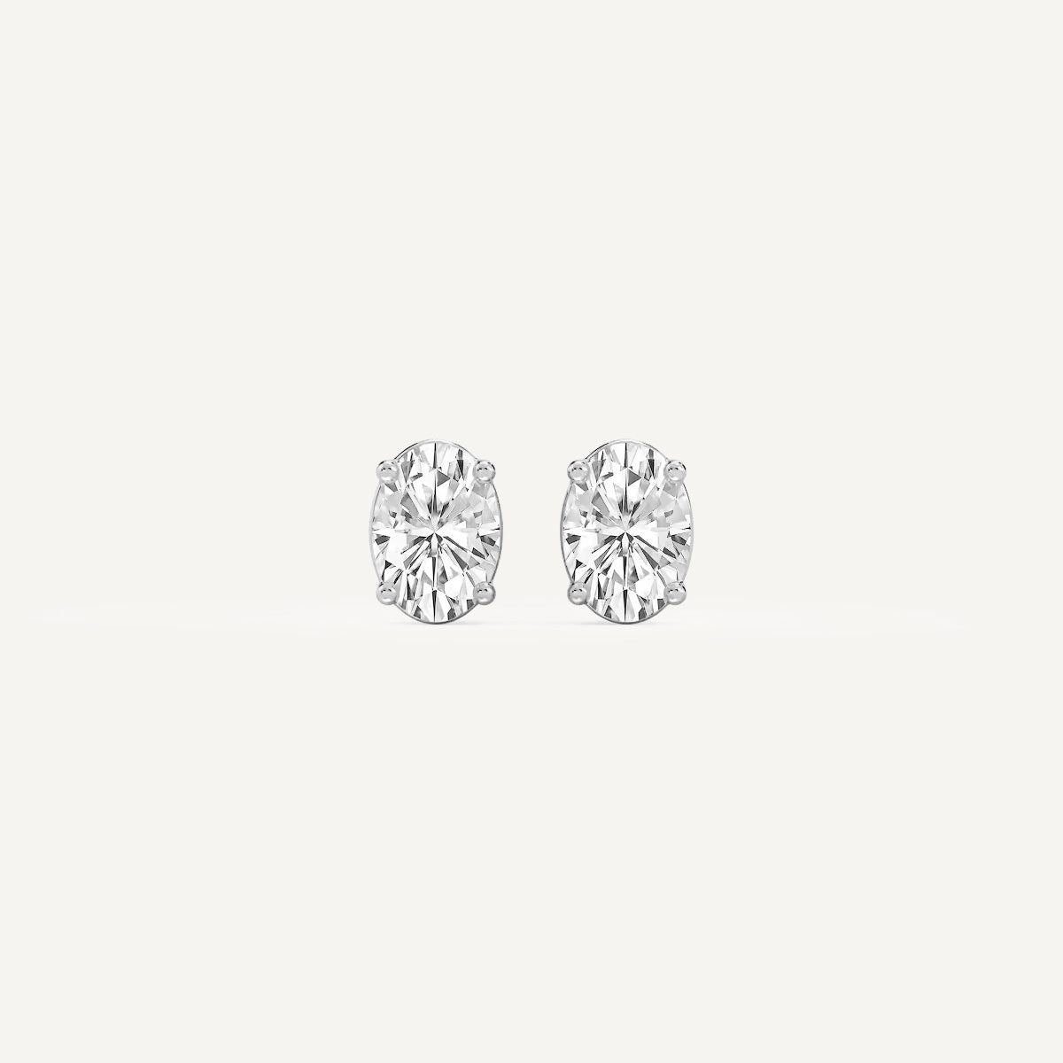 LUMEO Oval Cut Ear Studs Front View in Platinum or 18k Solid White Gold 