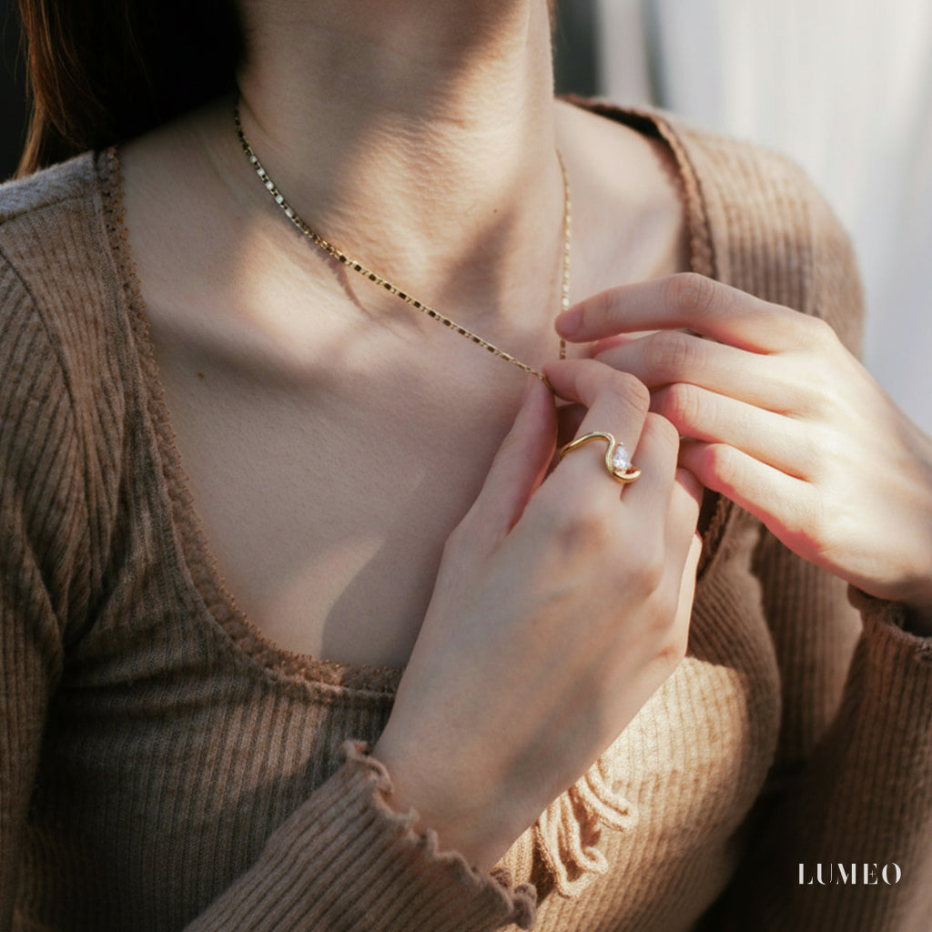 LUMEO Pear Trace Diamond Ring in 18k Solid Yellow Gold on model