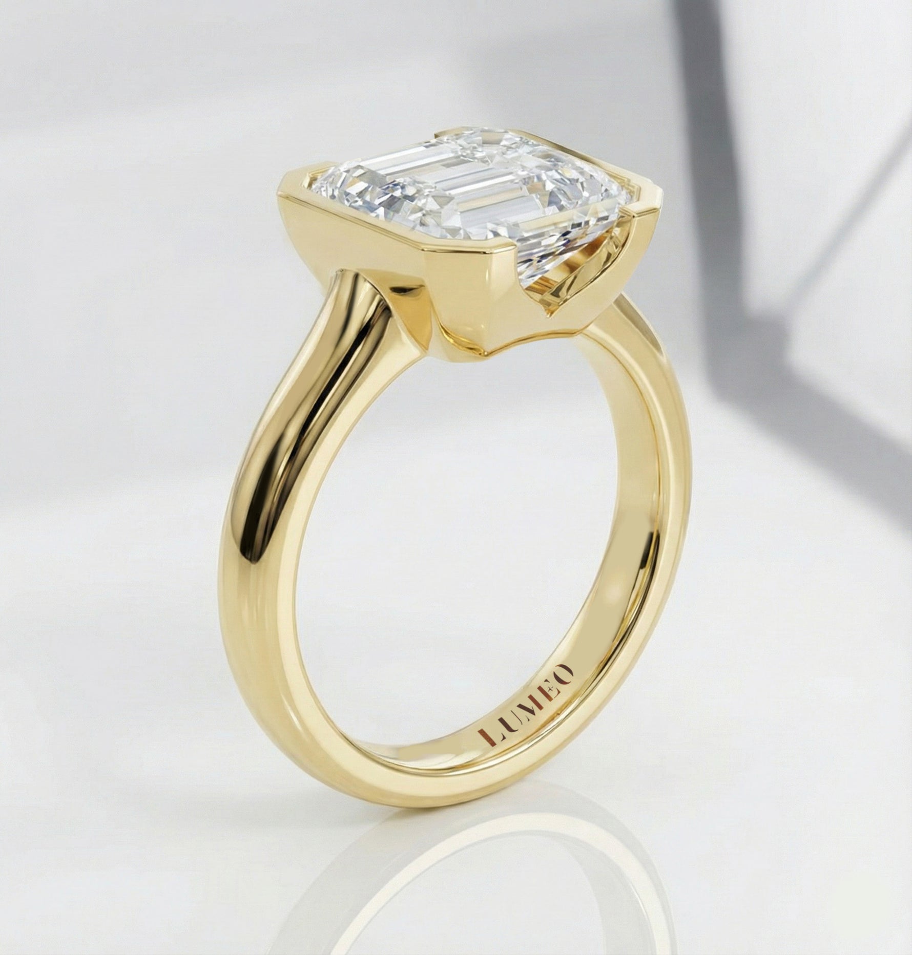 LUMEO The Blair Emerald Bezel Diamond Engagement Ring Side View in 18k Solid Yellow Gold 