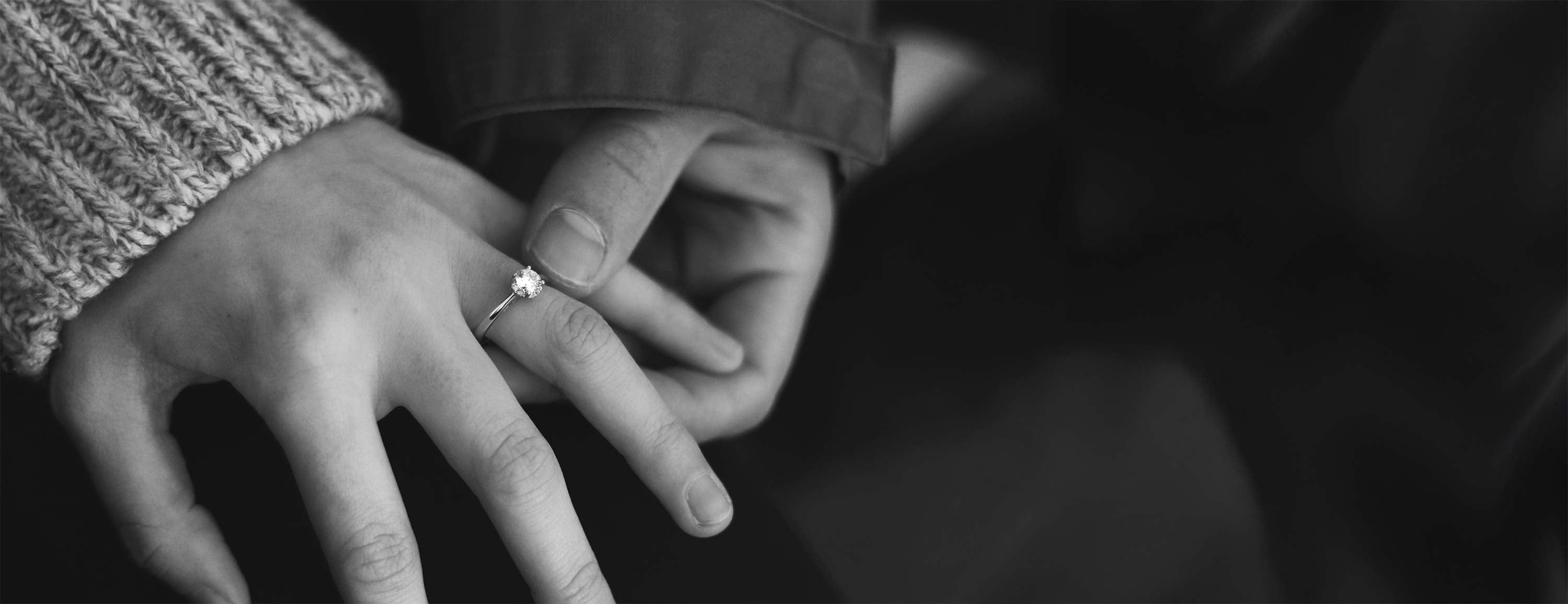 Hand wearing solitaire lab-grown diamond ring