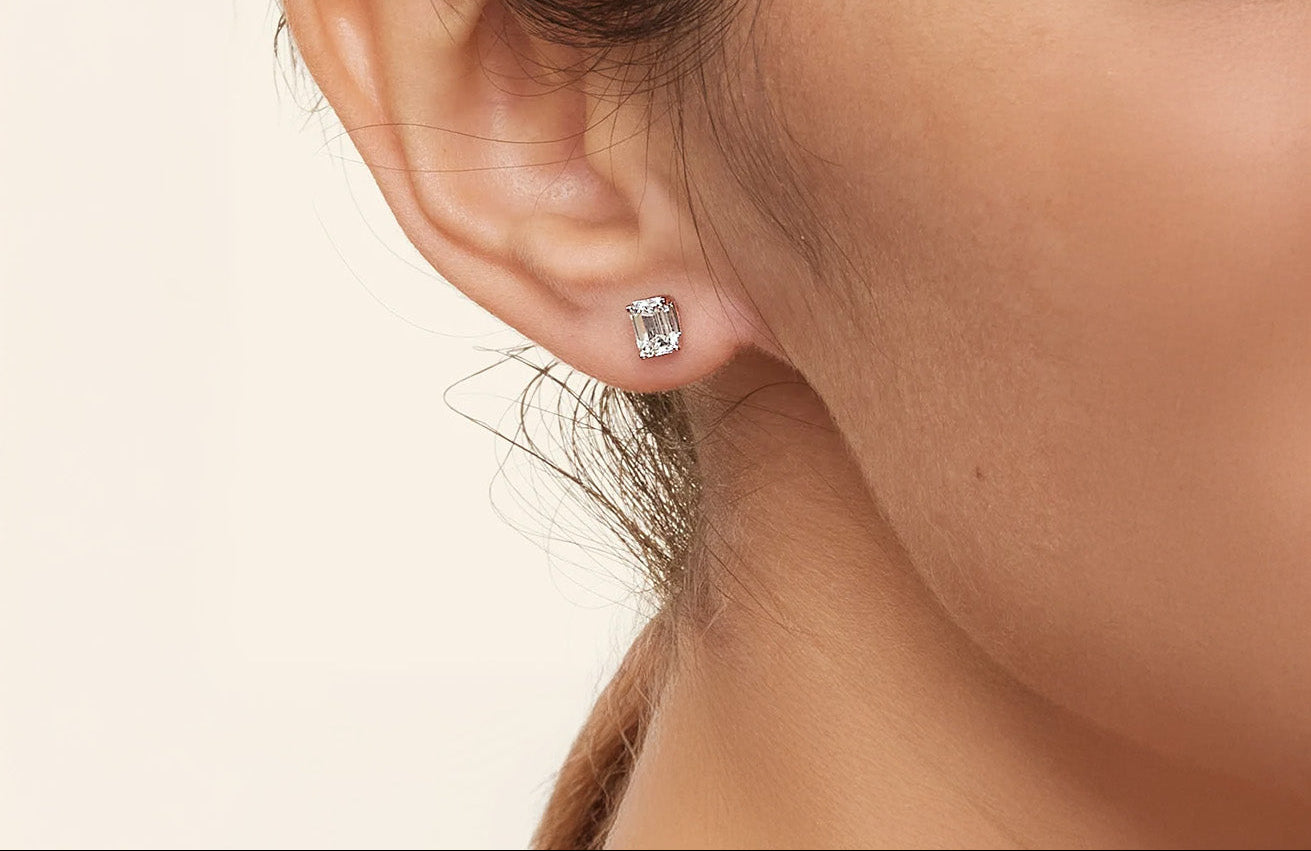 LUMEO Emerald Cut Ear Studs on female model in Platinum or 18k Solid White Gold 