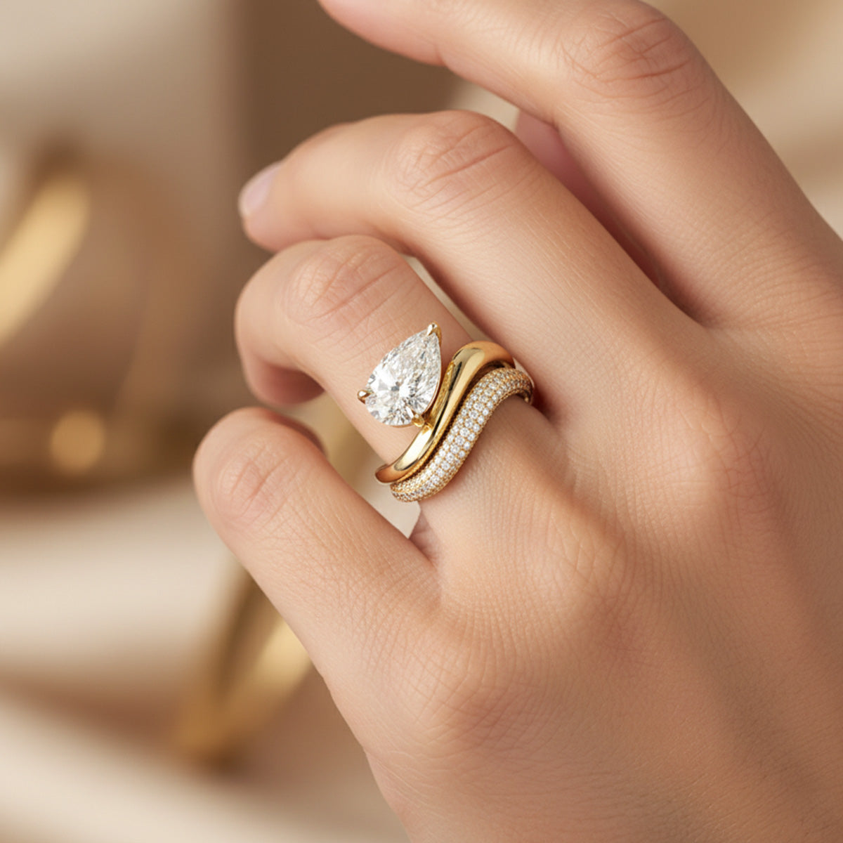 LUMEO Janna Pear diamond ring in 18k solid yellow gold on model